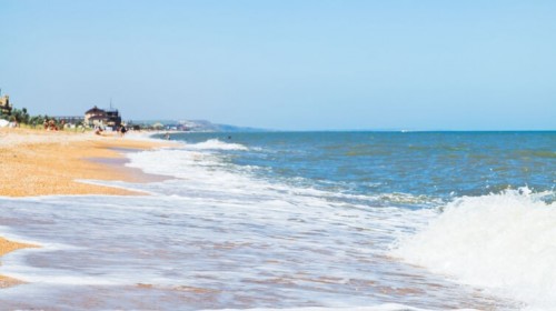 sand and seashells beach of Sea of Azov in resort town Golubickaya, Taman Peninsula, Russia